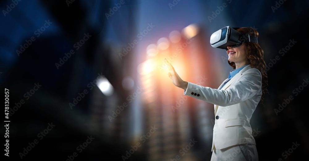 Wall mural Woman wearing virtual reality goggles