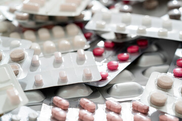 Background of a large group of assorted capsules and pills