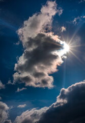 Fototapeta na wymiar sun rays and clouds