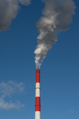 single chimney smoke environment blue sky