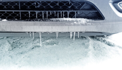 icicles on the bumper of a car - obrazy, fototapety, plakaty