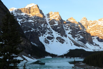 Beautiful morning at sunrise at Moraine Lake. Wonderful road trip through Banff and Jasper national park in British Columbia, Canada. An amazing day in Vancouver. What a beautiful nature in Canada.