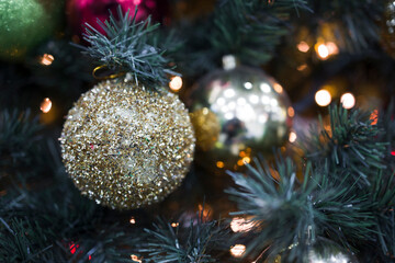 Obraz na płótnie Canvas Closeup of Festively Decorated Christmas tree . Selective focus