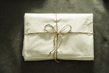 set of white bedding on gray background