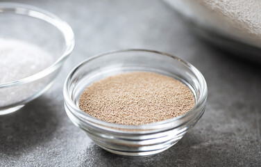 Glass bowl with yeast for baking.