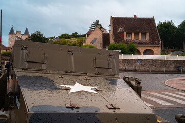 Arromanches, France - August 2, 2021: Old US military armored vehicle with a white star from World War II in Arromanches, the site of the Allied landing in Normandy