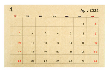 April 2022 brown calendar made from recycled paper isolated on white background.