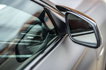 Side car mirror close-up. Details of business car