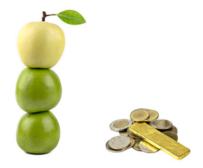 Apple yellow on apple green,coin silver and gold isolated on white background.
Concept different,leadership,business success.