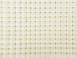 Old tennis racket net. Close up, macro photography. Tennis racket net texture, top view, background