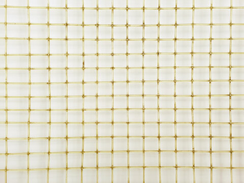 Old tennis racket net. Close up, macro photography. Tennis racket net texture, top view, background