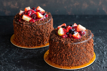 Fruit cake on a dark background. Close-up. Horizontal view