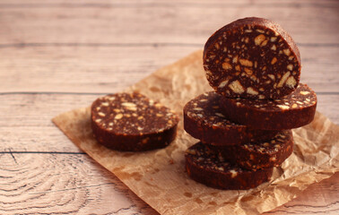 biscuit cake with pine nuts on a beige background