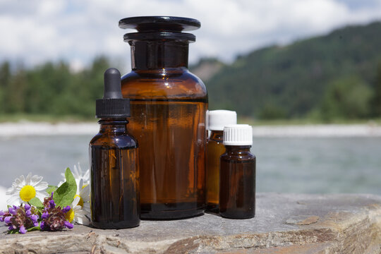 Group of bottles with medicines on natural background. Natural daylight.