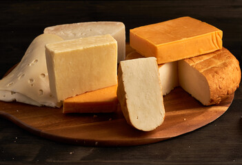 Variety of cheese on a wooden board