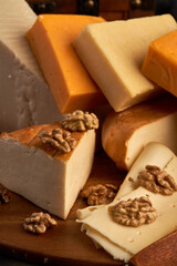 Variety of cheese on a wooden board
