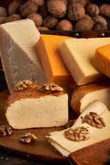 Variety of cheese on a wooden board