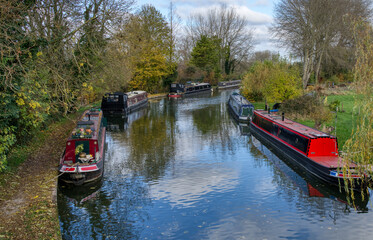 Canal boats in autumn rural scene
