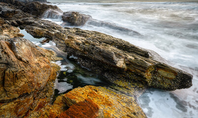 waves and rocks in long exposure