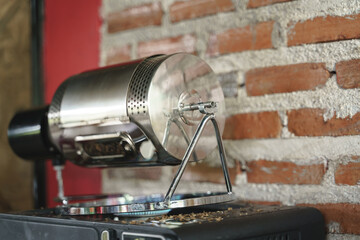  with stainless steel and rotary motor process by spinning roasted beans