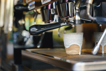 Fototapeta na wymiar Brewing espresso by coffee machine