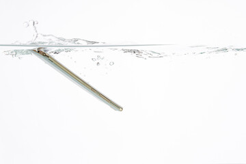 Modern mobile phone falls into the water