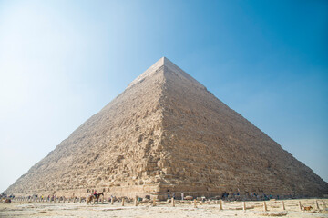 Obraz na płótnie Canvas Landscape of the pyramids in the desert with blue sky in Giza, Egypt 