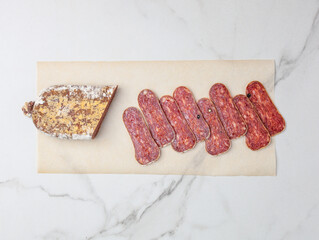 spiced sausage on a marble table - 478149243
