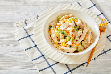 salad of chicken breast, corn, ananas, cucumber