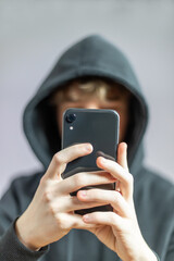 Teenager holds Smartphone