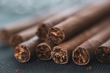 Little aroma cigars, close up. Tobacco smoking concept. Little depth of field, copy space