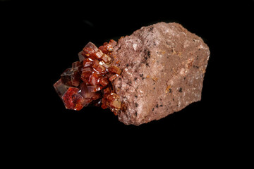 Macro mineral stone Vanadinite on a black background