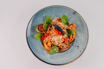 Pasta with assorted seafood in tomato sauce