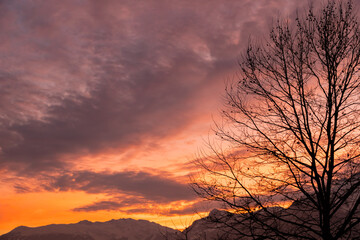 Fototapeta na wymiar Vaduz, Liechtenstein, December 14, 2021 Colorful sky over the alps in the evening