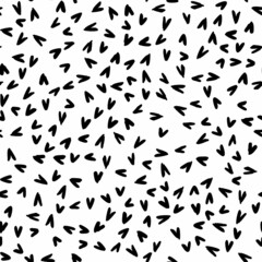 Seamless pattern with hand-drawn black little doodle hearts on white background