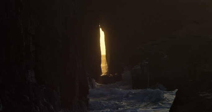 Ocean Waves Breaking Against Rocky Cliff With Famous Zawn Pyg (Song of the Sea) In Cornwall, UK. - wide shot