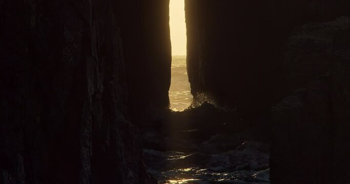 Zawn Pyg Rock Arch At Dusk With Crashing Waves In Nanjizal, Cornwall, United Kingdom. - static