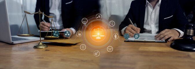 Concepts of Law and Legal services. Lawyer working with law interface icons. Blurred background.	