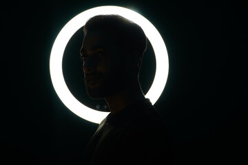 Young man with ring light creator with ring light