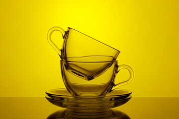beautiful cups on a yellow background