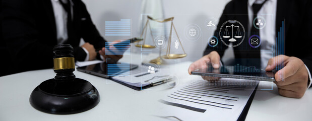Concepts of Law and Legal services. Lawyer working with law interface icons. Blurred background.	