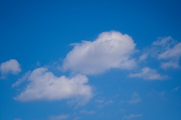 White clouds on a blue sky background