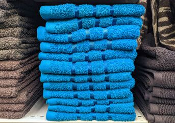 blue towels stacked in a pile