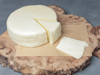 farm cheese on wooden stand on gray background - 478158495
