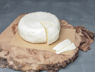 farm cheese on wooden stand on gray background - 478158633