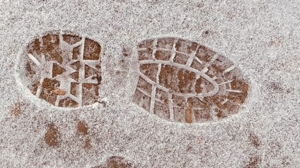 footprint of a shoe in the snow