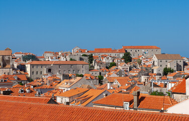 The city of Dubrovnik with its red roofed buildings and the blue sea in the background