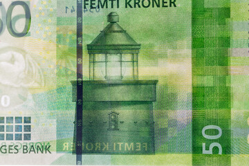 Stylized lighthouse beacon on 50 Norwegian krone banknote.