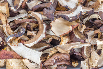 Sliced dried mushrooms. Heap of dried edible mushrooms.