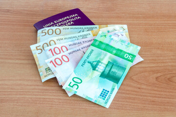 Norwegian krone (NOK) banknotes on Polish biometric passport.